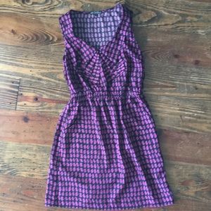 Tunic/size small with cute ruffle neckline detail.